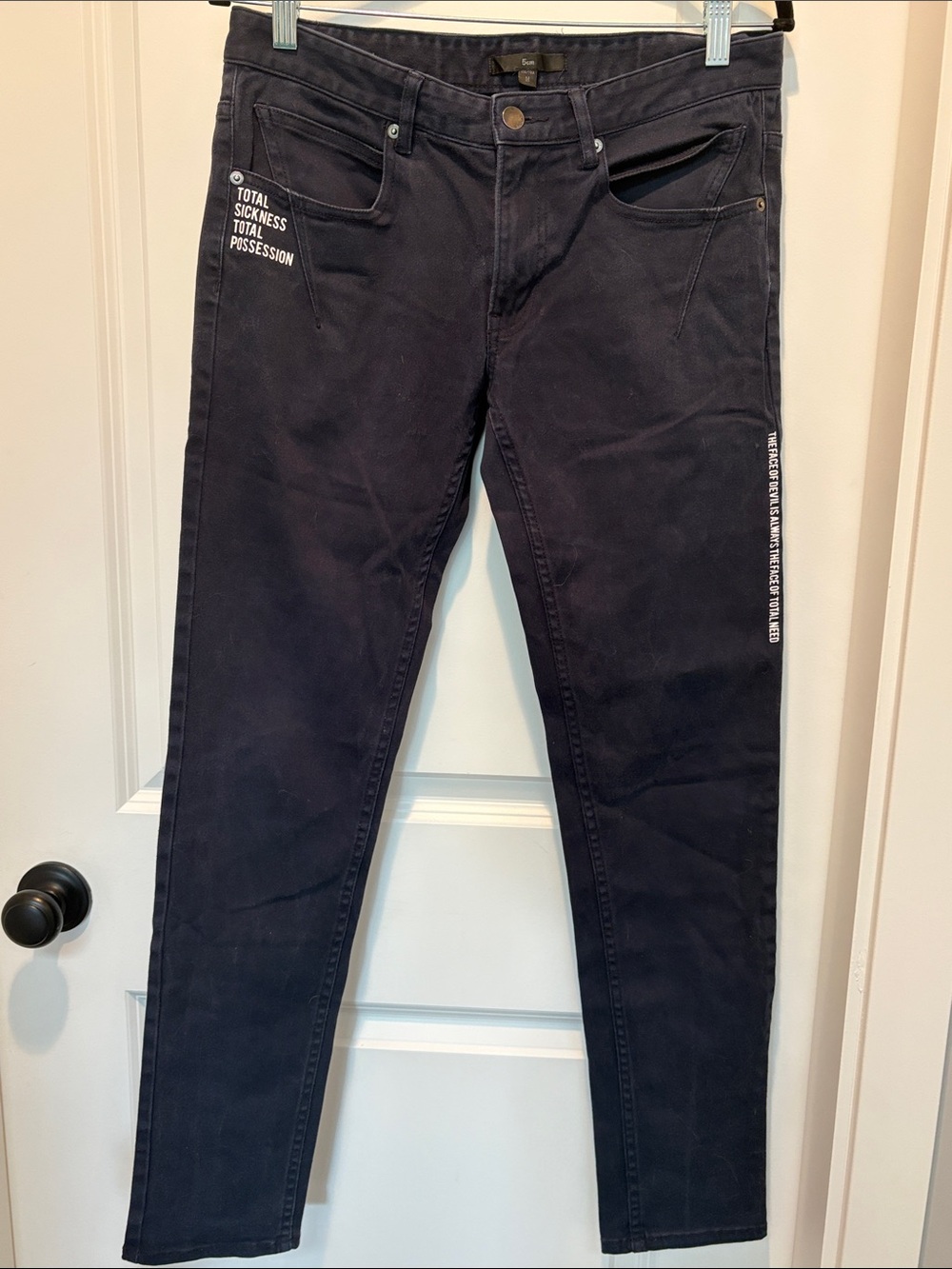 Women's dark Skinny Jeans with White Text Accent